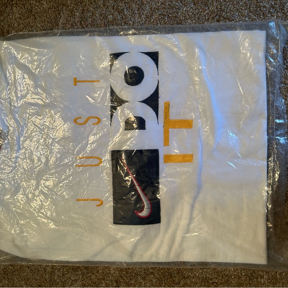 Nike White T‑Shirt with Red Swoosh Tag